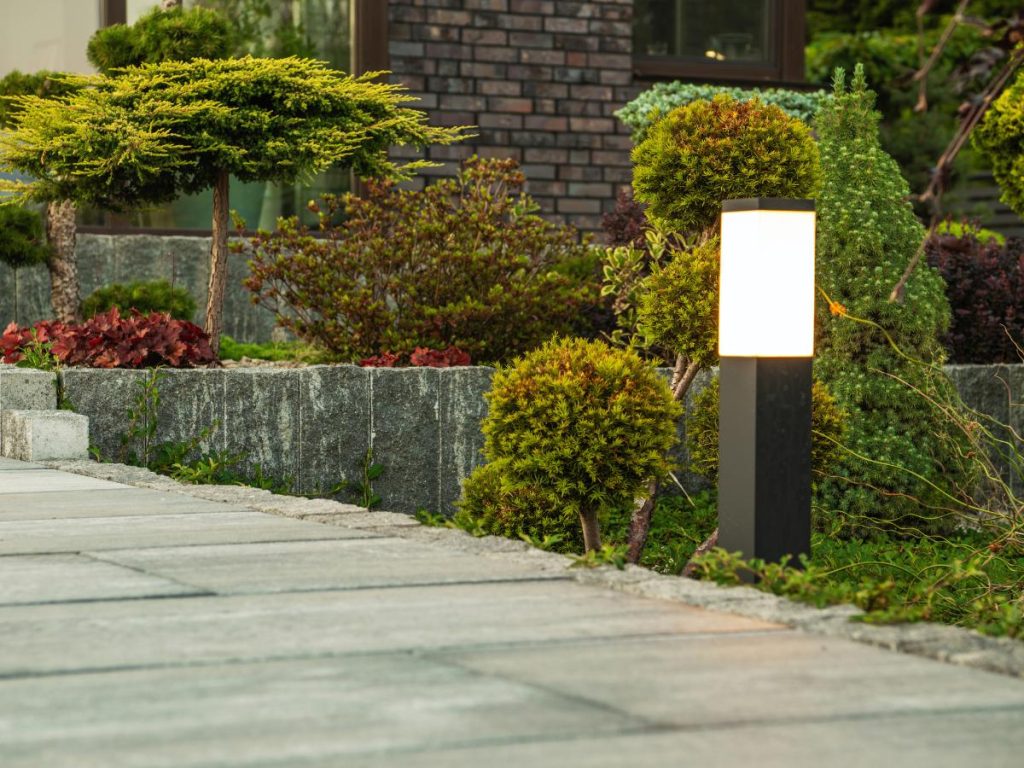 Custom backyard landscaping in Leawood, KS with patio design and new sod