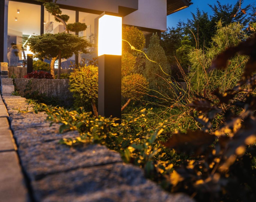 Front yard landscaping in Leawood, KS with stone edging and colorful perennials